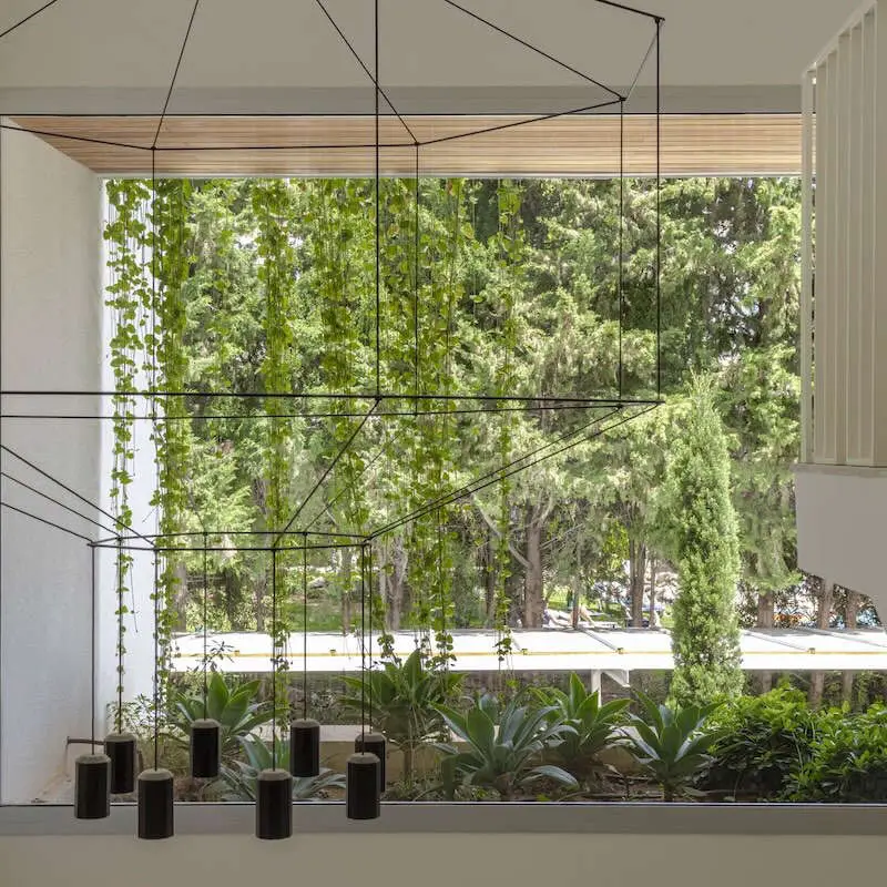 Modern Mediterranean interior overlooking a landscaped garden