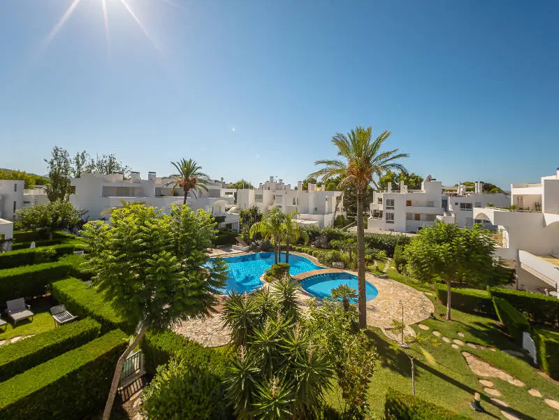 White Mediterranean apartments with gardens and a swimming pool in northern Mallorca